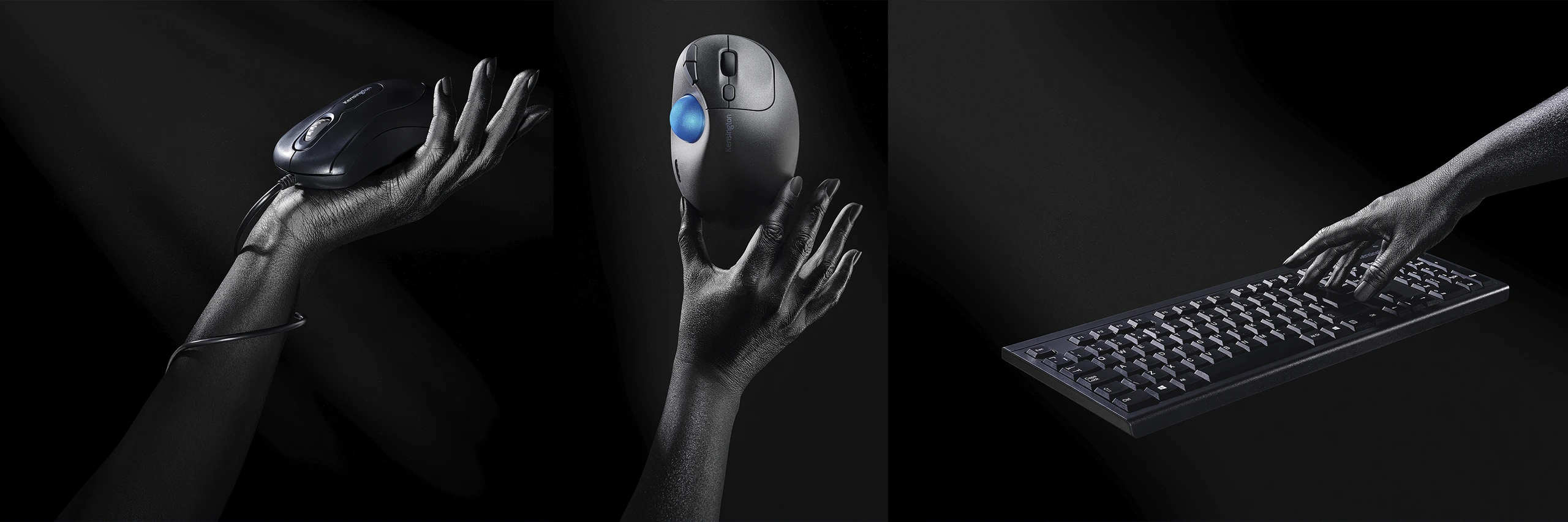 Creative advertising photography of computer mice and a keyboard held by hands against a black London studio background.