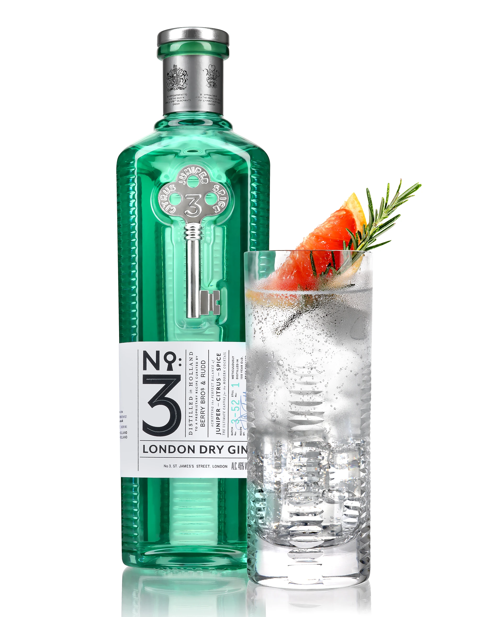 Commercial product photography of a No. 3 London Dry Gin bottle beside a gin and tonic garnished with grapefruit and rosemary.