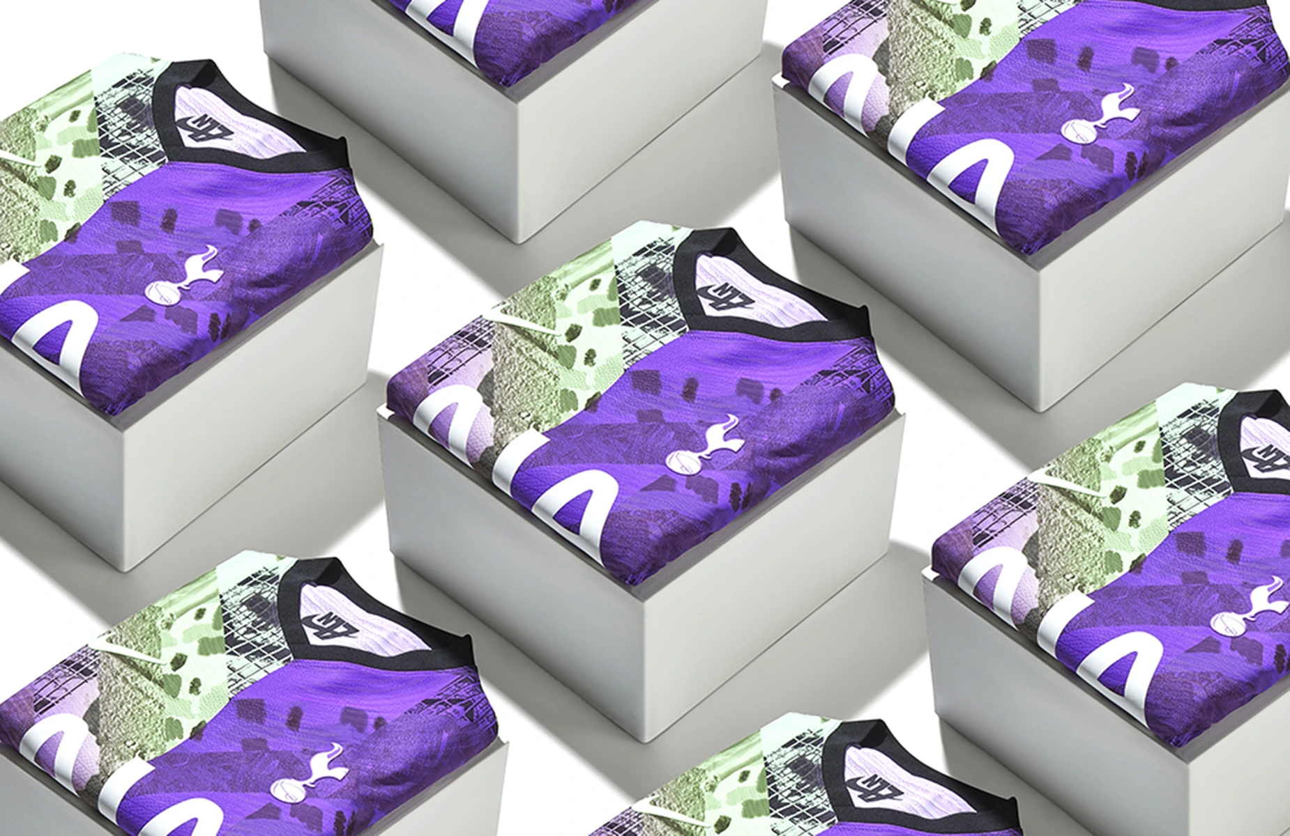 Commercial product photography of folded purple Nike Tottenham Hotspur football shirts displayed on white plinths at a London photography studio.